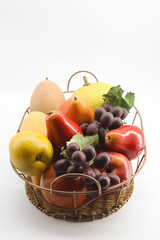 fruits and vegetables in basket isolated on white