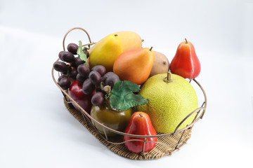 basket with fruits isolated on white