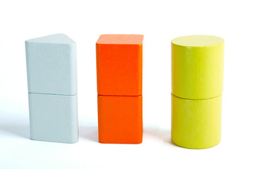 Baby sorter with geometric figures from wood on white isolated