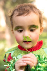  Little girl dressed as an elf in the forest