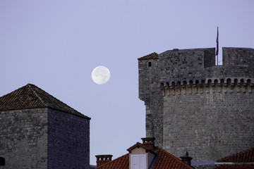 Moon over old city walls in Dubrovnik. Autumn. 