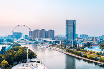Twilight scenery of Haihe River and Ferris wheel in Tianjin, China