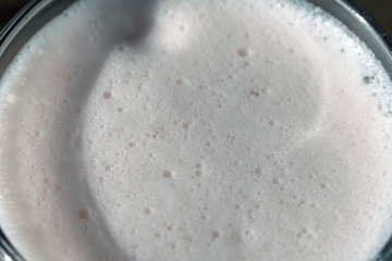 Oxygen foam in a glass beaker. An oxygen cocktail is a drink rich in oxygen and vitamins. Body improvement. Oxygen therapy