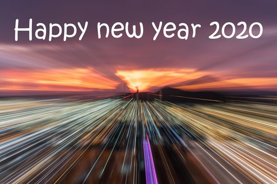 Happy new year 2020 text on Smooth Running focus to coastal city on colorful cloudy sky background in twilight time