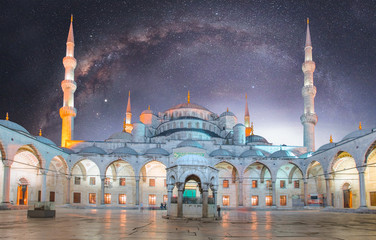 Blue Mosque (Sultanahmet Camii) against spiral galaxy milky way at dusk, Istanbul, Turkey