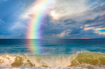 Rainbow over the stormy sea after rain