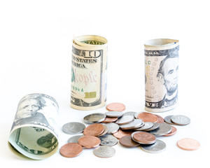 Studio shot variety of small denomination US dollars banknotes and coins isolated on white
