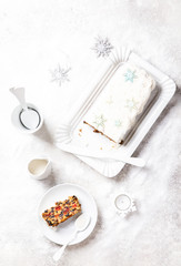 Obraz na płótnie Canvas Christmas Fruit Cake, Pudding on snowy background . New Year pastries