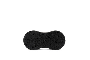 Black sponge for cleaning and washing close up, isolated on white background.