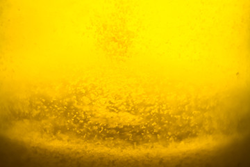 yellow transparent honey lit with the light