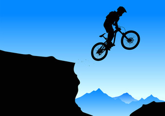 Silhouette of a cyclist on a mountain background.
