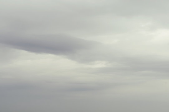 Soft background with stratus clouds. Dramatic cloudscape under cinematic color filter.