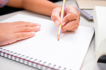 Child Start Writing on Notebook