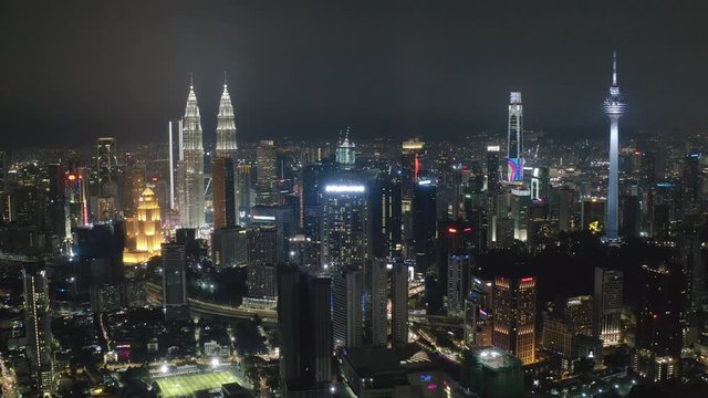 Aerial view of Kuala Lumpur skyline and calm urban landscape sleeping at night in slow motion