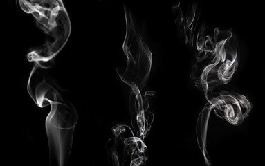 Set of white smoke on a black background.
