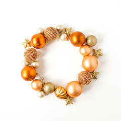 Christmas / New Year holiday composition. Frame wreath with mock up copy space of ginger Christmas baubles, balls and stars on white background. Flat lay, top view festive concept.