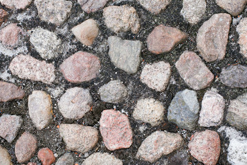 Rocky ground pavement made with stones texture.