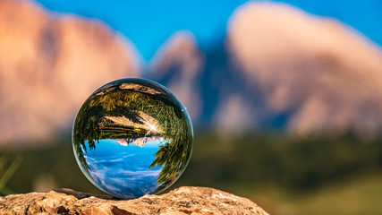 Crystal ball alpine evening landscape shot at the famous Seiser Alm, South Tyrol, Italy