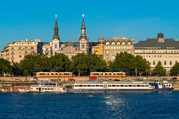 Budapest, Hungary - October 01, 2019: Cityscape of Budapest with Orthodox Cathedral of Our Lady with Budapest tram, passenger boats on the Danube river, Budapest, Hungary.