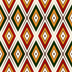 Seamless pattern in Christmas traditional colors. Repeated rhombuses bright ornamental abstract background.