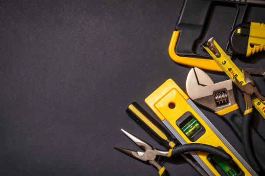 Tools for master builder on a black background