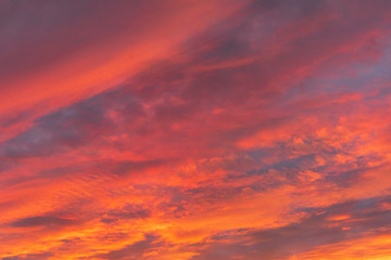 Naklejka na ściany i meble Dramatic fiery sky sunset cloudscape at dusk