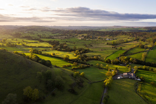 Stunning aerial drone landscape image of Peak District countryside at sunrise on Autumn Fall morning