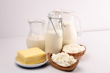 Different  healthy dairy products on rustic background with milk, cheese, butter and cottage