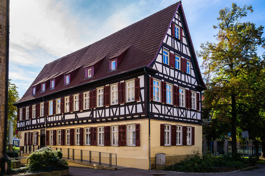 Germany, Historical red timbered house in city kirchheim unter teck in historic district next to green trees