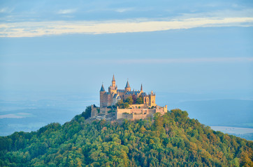 Obraz premium Hilltop Hohenzollern Castle on mountain top in Swabian Alps, Baden-Wurttemberg, Germany