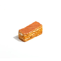Appetizing fresh cakes on a white background. Sunlight.