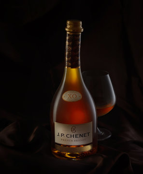 POLTAVA, UKRAINE, May 13, 2017: Photo of a bottle of J. P. Chenet french brandy On a black background