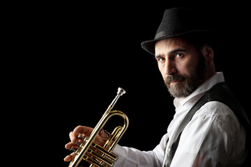 trumpet man with beard portrait on black
