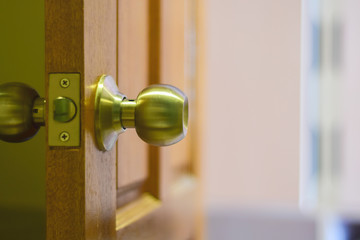 Door opening. Wooden door with metal brass knob door for decorate in luxury home.