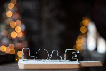 Word love on the background of a Christmas tree. Happy new year