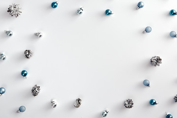 Blue baubles and cones on white