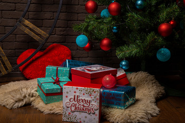 Christmas gifts in boxes under the tree