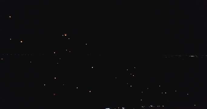 Wide, people release lanterns during festival
