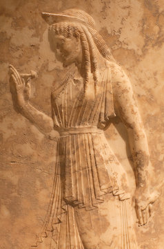 Ancient Greek bas-relief with dancing female figure (Nymph or Grace) 