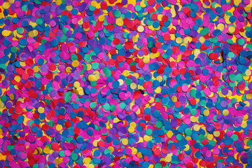 Confetti festive background. Texture of colored circles made of paper, closeup