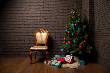 vintage chair near the Christmas tree with New Year's gifts