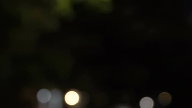 Backplate for green screen replacement, side view from car driving through New York City at night, quiet neighborhood