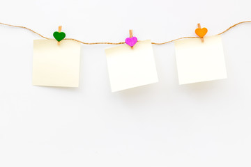 Mockup with heart icons garland and sticky notes on white background top view space for text
