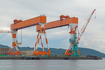 Two huge shipbuilding Gantry Cranes at the shipyard