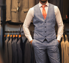 Young man in expensive strict fashionable plaid suit.