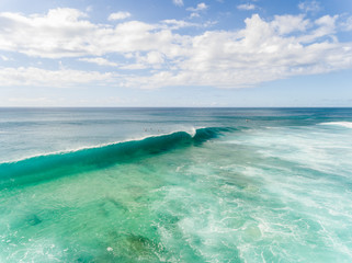 Aerial view of a breaking wave in Hawaii