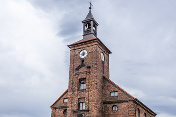Fototapeta na wymiar Old brick building of City Hall in Obrzycko town, Poland
