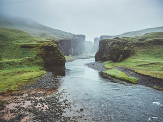 Famous fjadrargljufur canyon in Iceland with moody weather 