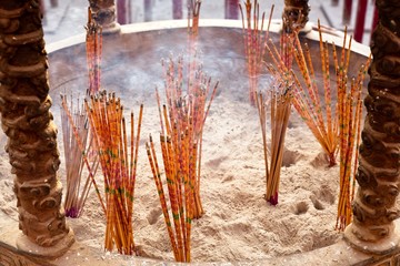 Colourful incense sticks burning in the temple