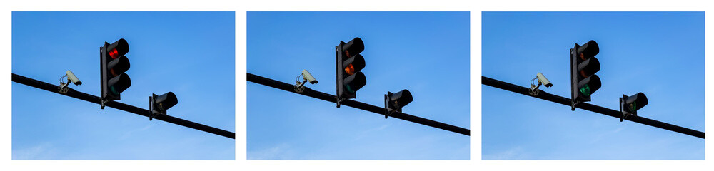 Set of red, yellow and green traffic lights and outdoor surveillance camera installed on a pole...